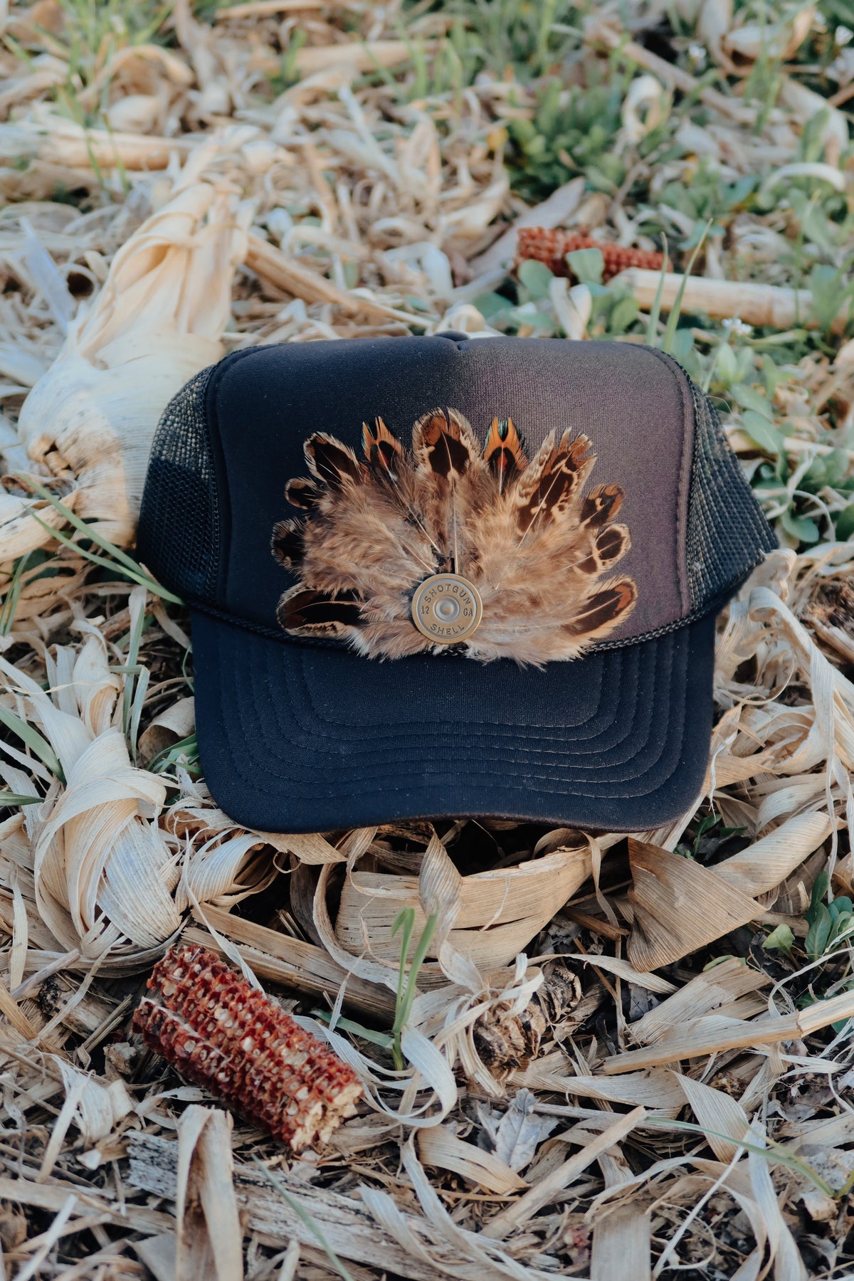 Outlaw Brass Trucker Hat